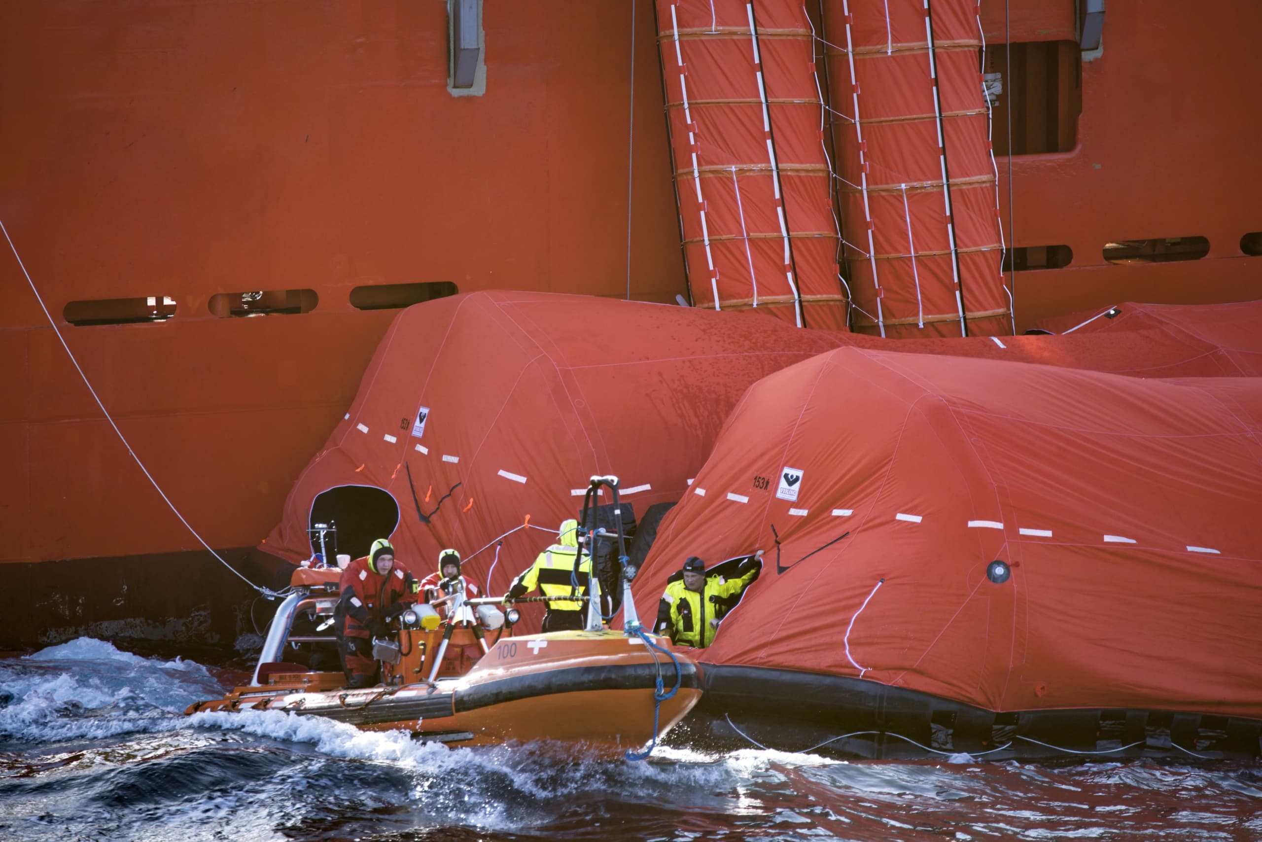 VIKING liferafts and rescue craft alongside a ship during an open-water trial